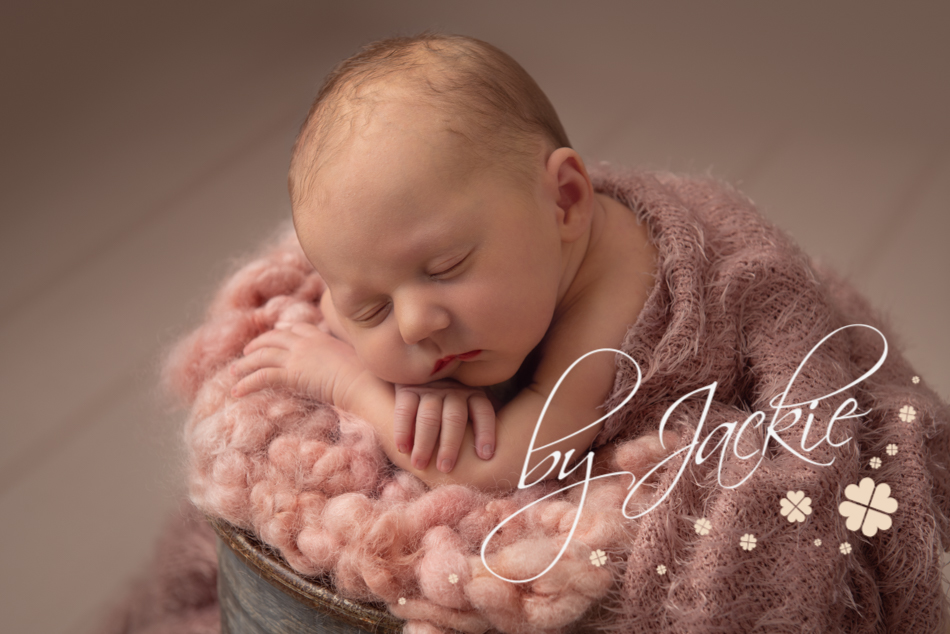 Cute baby girl in bucket photo by Babies By Jackie Photography, York, Leeds, Harrogate, Beverley