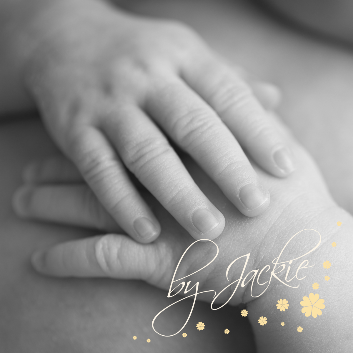 Close up image of baby's hand holding his own foot by Babies By Jackie Photography, specialist baby photographer in York, Leeds, Harrogate