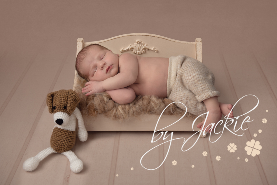 Newborn Baby In Bed Portrait by Babies By Jackie Photography, York, Leeds, Harrogate, Beverley