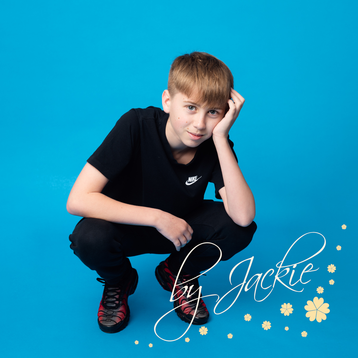 Teen Portrait of boy with blue background with Babies By Jackie Photography in Yorkshire, UK