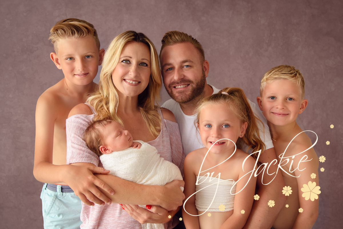 Family portrait with newborn baby girl and three siblingsby Babies By Jackie Photography, specialist baby photographer in York, Leeds, Harrogate
