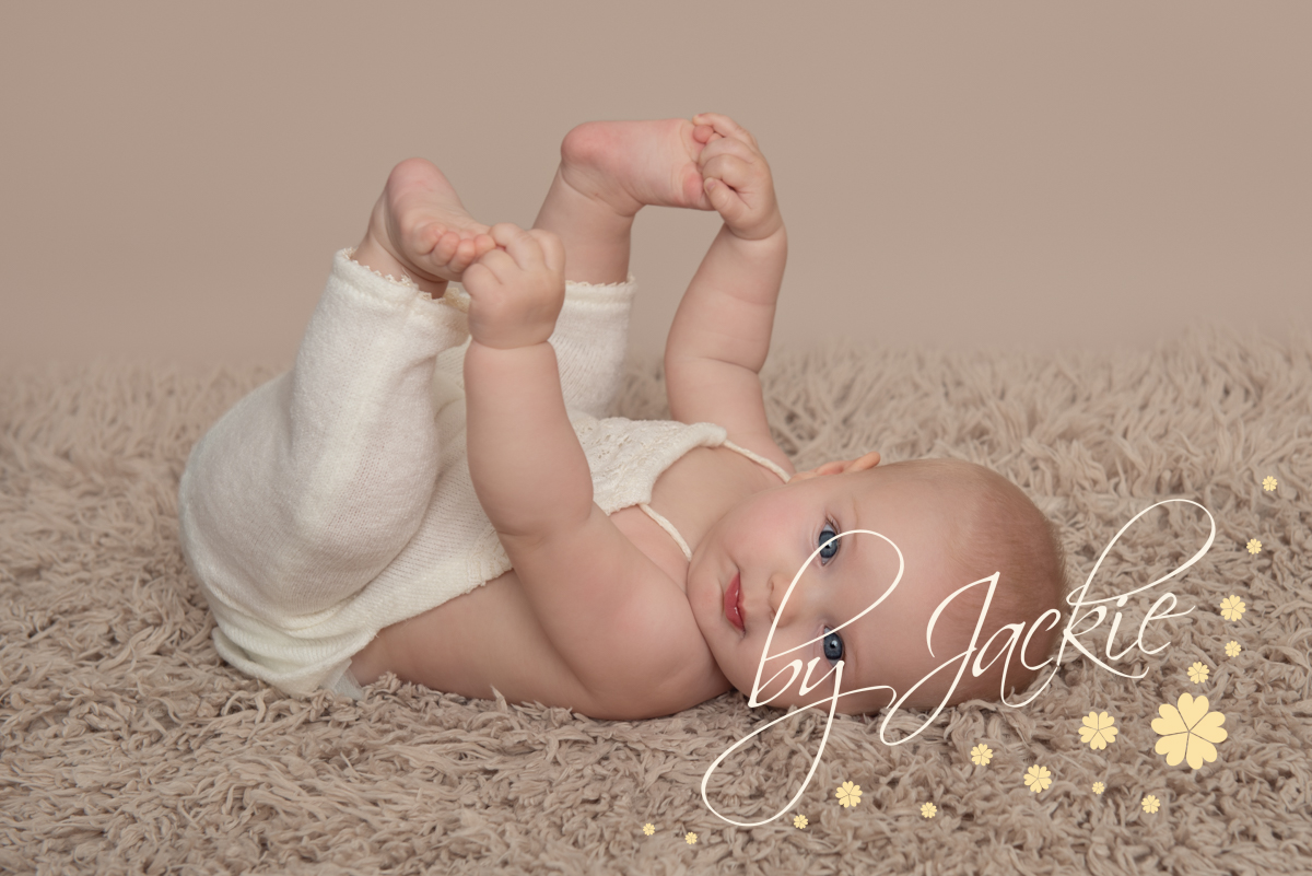 Baby girl at 4 month milestone sitter session with Babies By jackie Photography, York