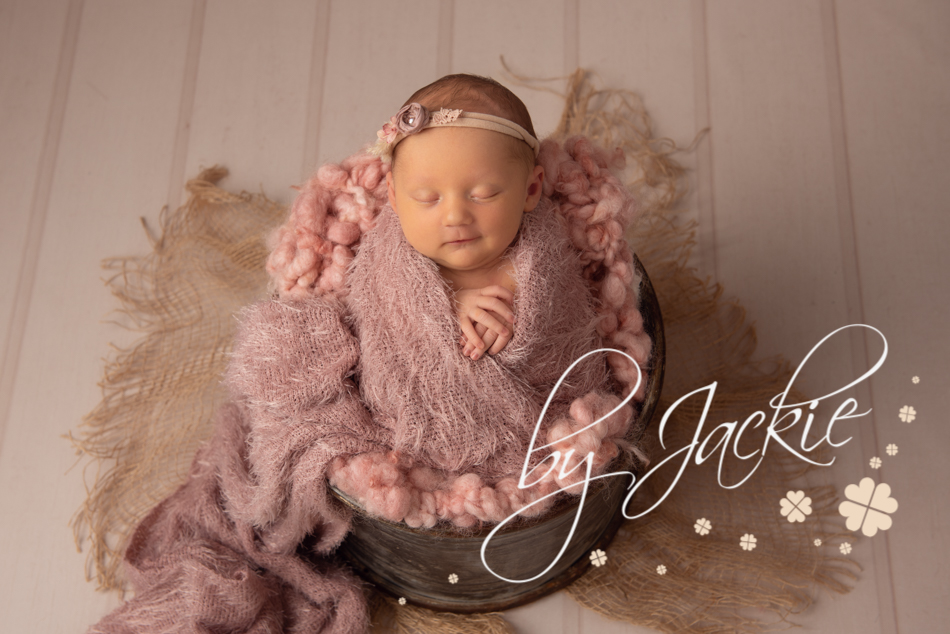 Cute baby girl in bucket photo by Babies By Jackie Photography, York, Leeds, Harrogate, Beverley