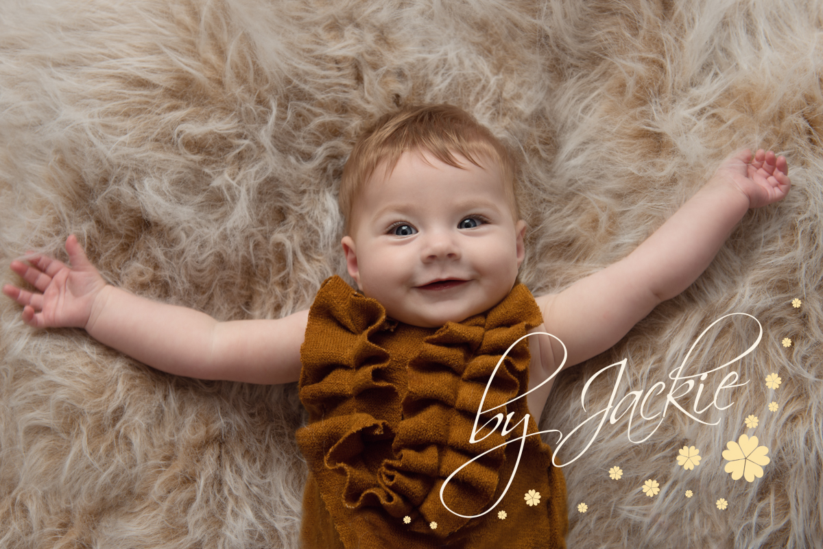 Baby girl facial expressions series 3 of 4 by Babies By Jackie Photography, specialist baby and child photographer in York, Leeds, Harrogate