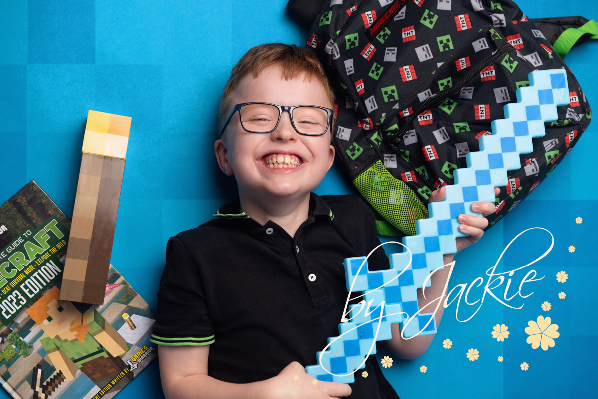 Teen Portrait of Boy with Minecraft toys by Babies by Jackie