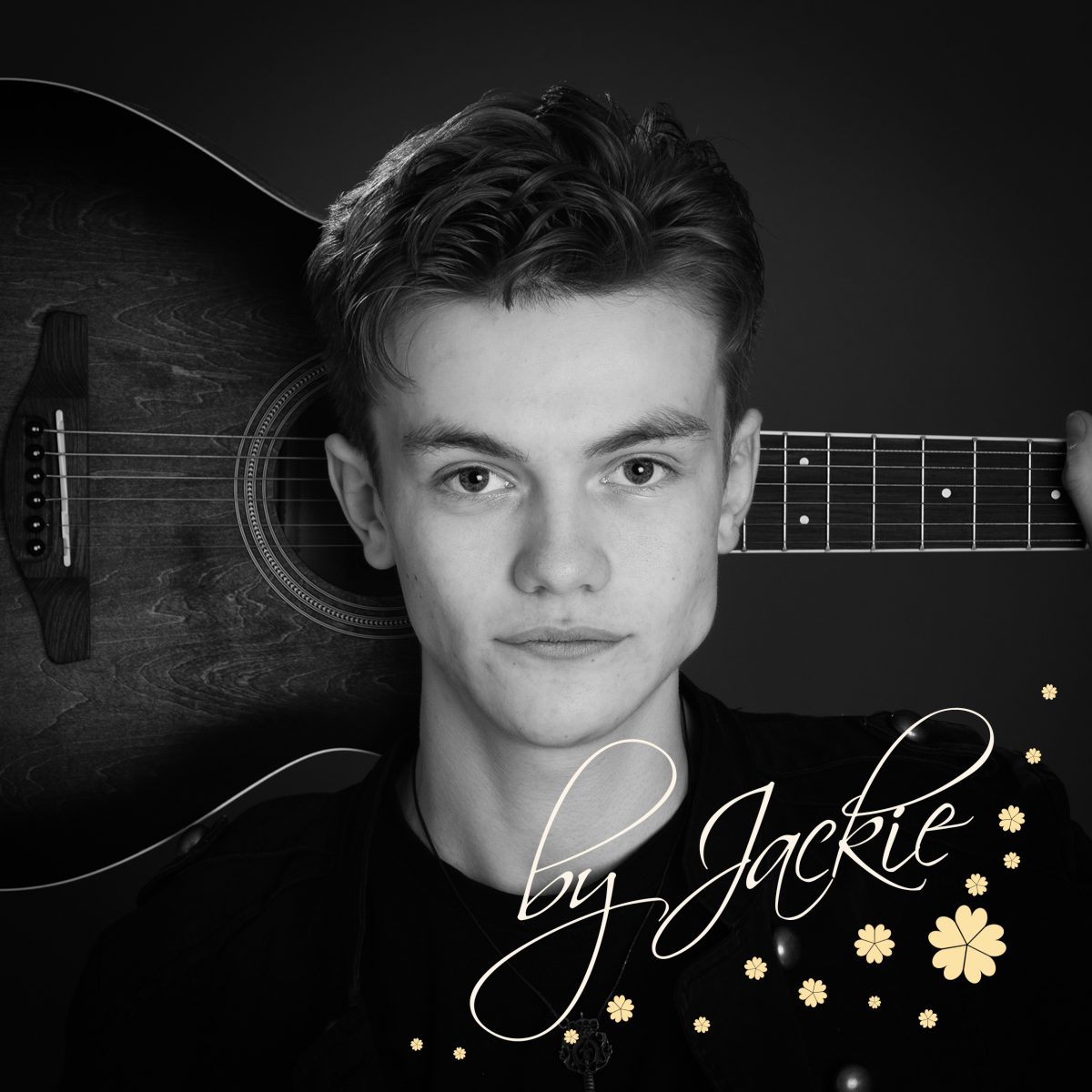 Black and white image of teen with guitar