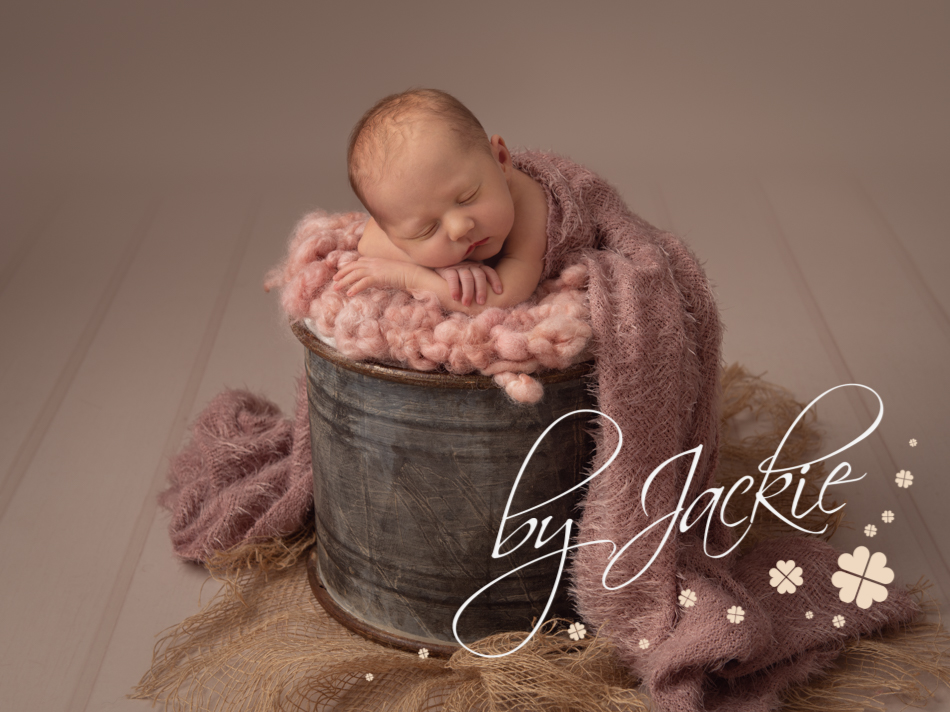 Super cute newborn baby girl in bucket photo by Babies By Jackie Photography, York, Leeds, Harrogate, Beverley