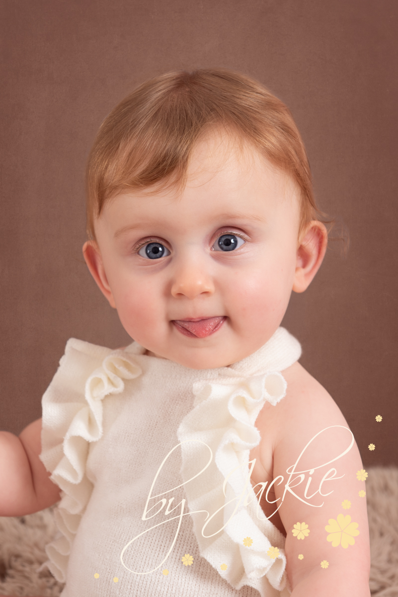 Baby girl twins at milestone sitter photoshoot with Babies By Jackie Photography, specialist baby and child photographer in York, Leeds, Harrogate