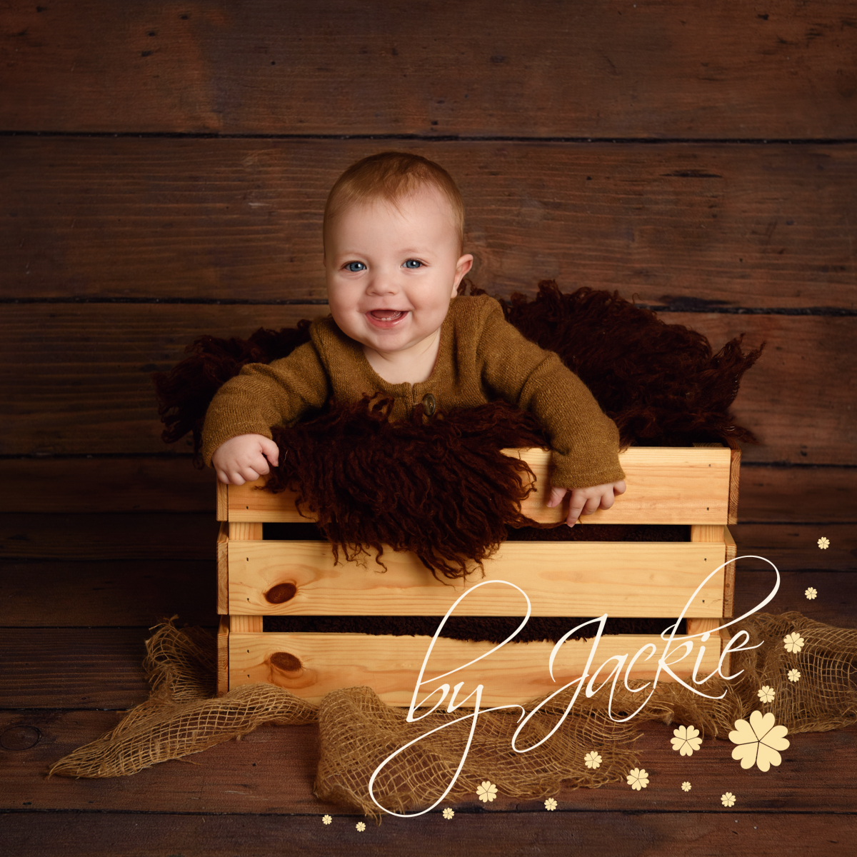 Baby boy in apple crate at sitter session by Babies By Jackie Photography, specialist baby and child photographer in York, Leeds, Harrogate