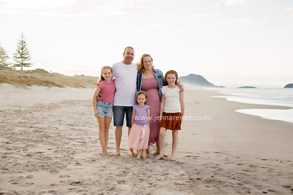Portrait of family in park at sunset
