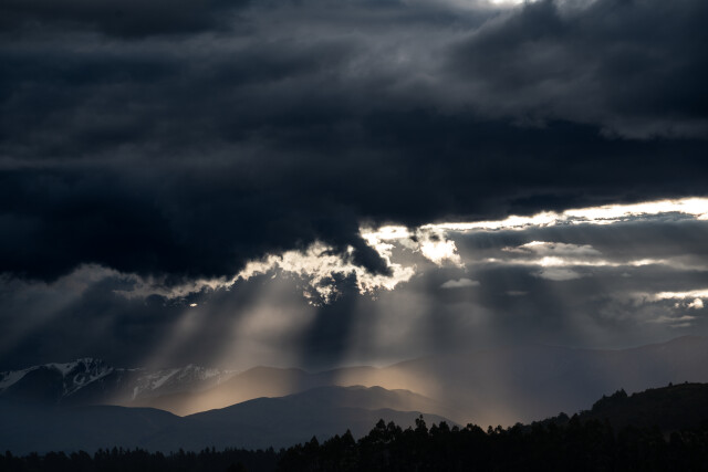 Stormy clouds and fingers of light